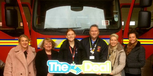 Image of Rebecca and council members in front of a fire engine 