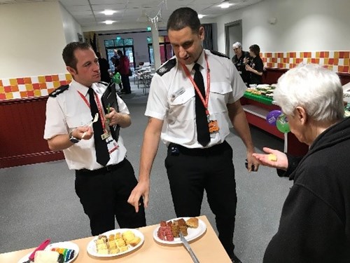 Image of Our cake judges were Chaplin Beryl Proctor, Group Manager Val Hussain and Watch Manager Dave Berry picking the best cake.