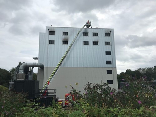 Image of the high rise building at the safety centre with new TTL rescuing people.